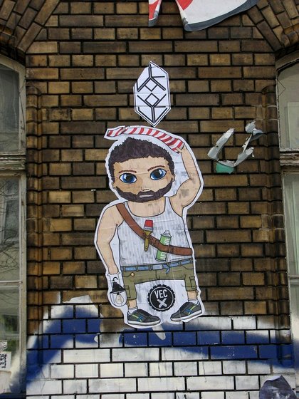 Sticker eines Mannes mit Lampe, Pinsel und Sprühdose