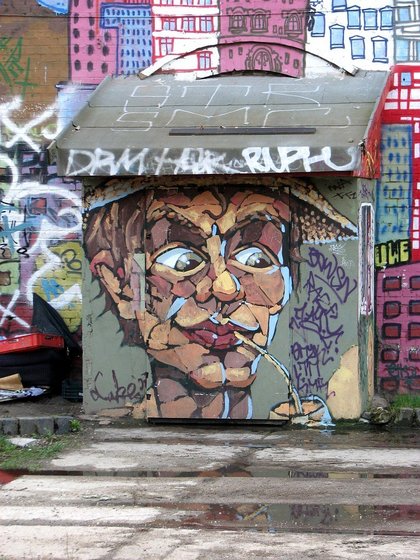 Malerei eines Mannes mit Hut, der aus einem Strohhalm trinkt